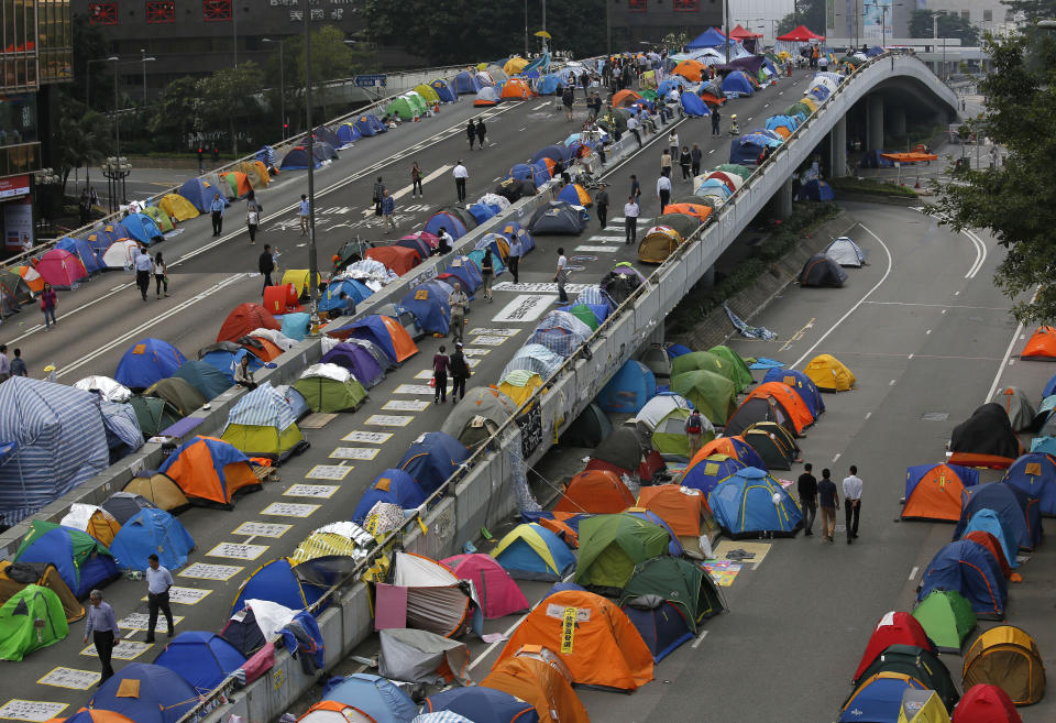 FILE - Tents set up by pro-democracy protesters are seen in an occupied area outside the government headquarters in Hong Kong's Admiralty district in Hong Kong on Nov. 11, 2014. (AP Photo/Vincent Yu, File)