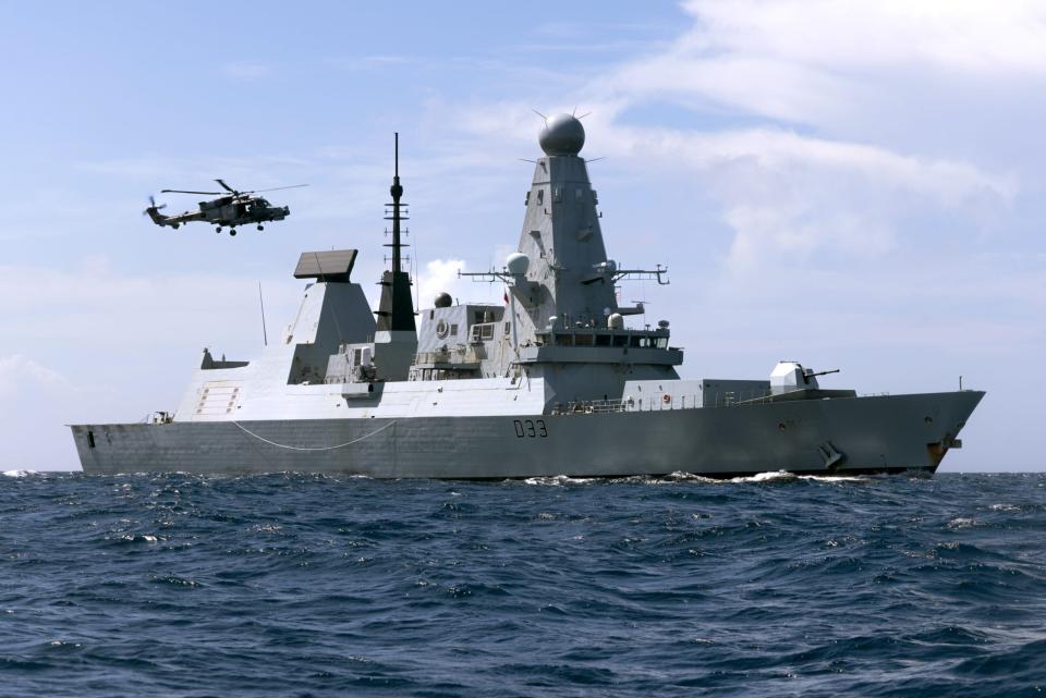 The Type 45 destroyer HMS <em>Dauntless</em> and a Wildcat helicopter from 815 Naval Air Squadron. <em>Crown Copyright</em>