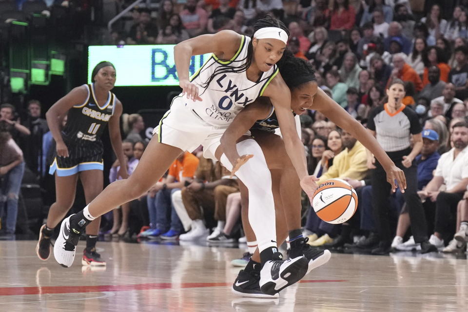 FILE - Minnesota Lynx's Maya Dodson, left, battles Chicago Sky's Emma Meesseman for a loose ball during the second half of a WNBA preseason basketball game in Toronto Saturday May 13, 2023. The WNBA is heading to Toronto, according to media reports. The Canadian Broadcasting Corporation reported that the women’s professional basketball league has awarded a franchise to the Kilmer Group. The reported deal would have Toronto’s WNBA team start playing in May 2026. (Chris Young/The Canadian Press via AP, File)