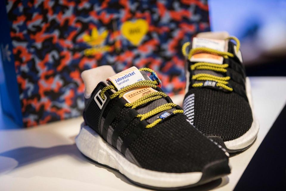 Shoppers camp out for days for limited edition Adidas trainers that double as free transport season ticket worth £650