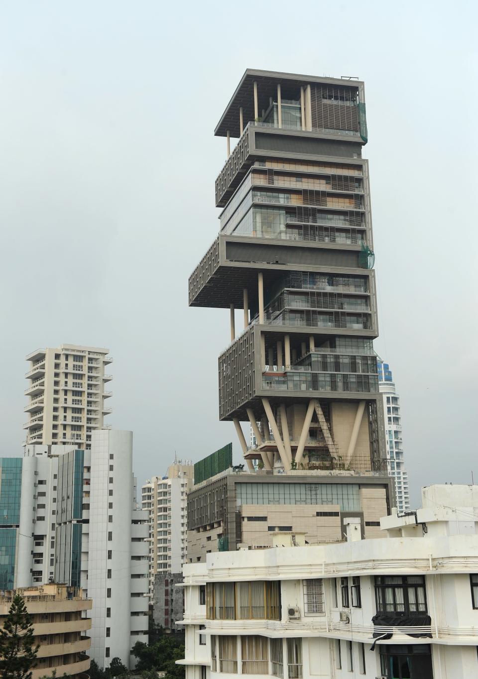 <p>At Rank 18, is perhaps the most-talked about buildings in recent times. <b>Antilia (pictured)</b> is the 27-floor personal home in South Mumbai belonging to businessman Mukesh Ambani, chairman of Reliance Industries. According to some media reports, a full-time staff of 600 maintains the residence, reportedly the most expensive home in the world. The building is named after the mythical Atlantic island of Antillia.</p> <p>The Antilia building is situated on an ocean-facing 4,532 square metres (48,780 sq ft) plot at Altamount Road, Cumballa Hill, South Mumbai.</p> (AFP PHOTO/Indranil MUKHERJEE)