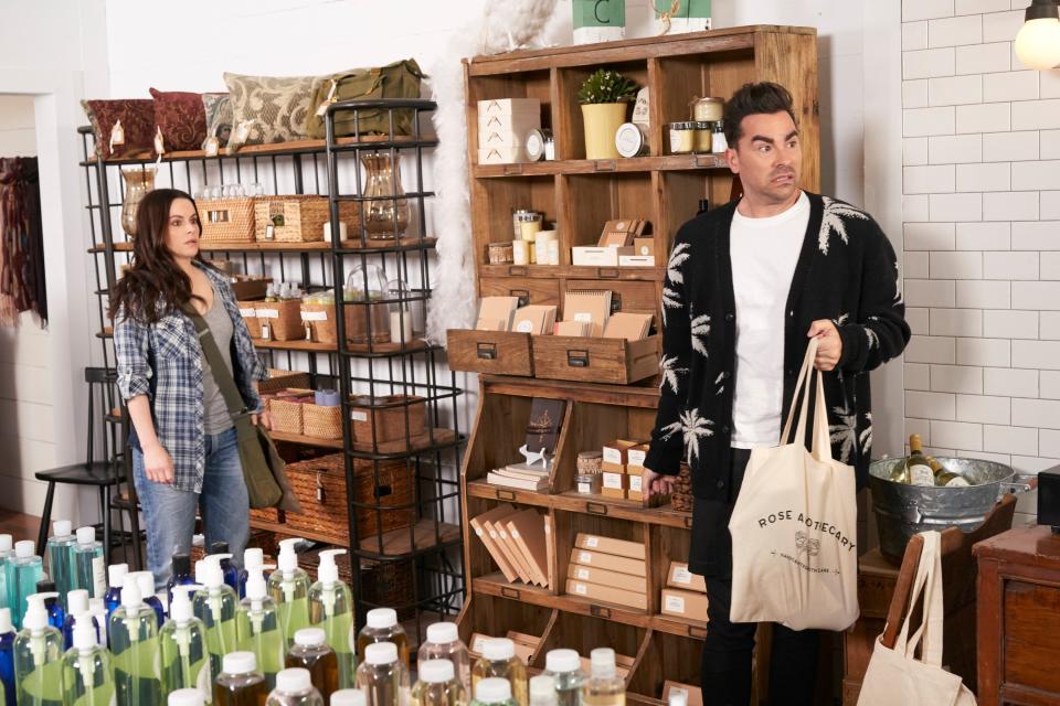 Hampshire and Levy stand in their soap store in Schitt's Creek