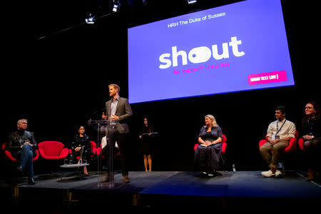 Britain’s Prince Harry and Meghan, Duchess of Sussex, meet crisis volunteers working with Shout, a free text messaging service which aims to provide 24/7 support for anyone experiencing mental health crisis, in London, Britain, in this undated handout photo released May 9, 2019. Shout/PA Wire via REUTERS