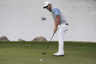 Andrew Landry watches his birdie putt fall in the 18th hole during the final round to win The American Express golf tournament on the Stadium Course at PGA West in La Quinta, Calif., Sunday, Jan. 19, 2020. (AP Photo/Alex Gallardo)