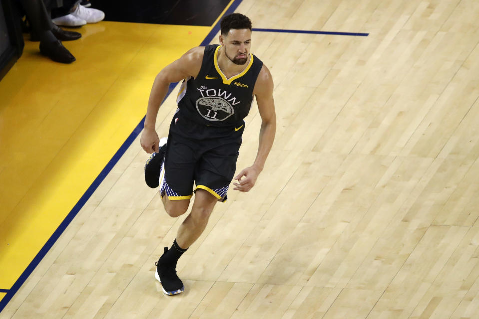 OAKLAND, CALIFORNIA - JUNE 13:  Klay Thompson #11 of the Golden State Warriors celebrates the basket against the Toronto Raptors in the first half during Game Six of the 2019 NBA Finals at ORACLE Arena on June 13, 2019 in Oakland, California. NOTE TO USER: User expressly acknowledges and agrees that, by downloading and or using this photograph, User is consenting to the terms and conditions of the Getty Images License Agreement. (Photo by Ezra Shaw/Getty Images)