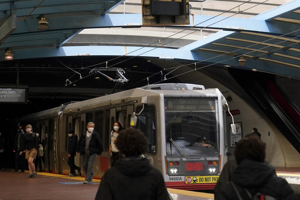 Passengers exit a streetcar at a Muni station in San Francisco, Tuesday, June 6, 2023. California's public transit agencies say they are running out of money, plagued by depleted ridership from the pandemic and soon-to-expire federal aid. But California's state government is having its own financial problems, leaving the fate of public transit agencies uncertain in this car-obsessed state. (AP Photo/Jeff Chiu)