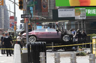 <p>A car rests on a security barrier in New York’s Times Square after driving through a crowd of pedestrians, killing one person and injuring at least a dozen, May 18, 2017. (AP Photo/Mary Altaffer/AP) </p>