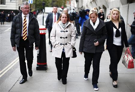 Family members of British soldier Drummer Lee Rigby leave during a lunch break in the trial of his suspected murderers at the Old Bailey in central London December 3, 2013. REUTERS/Andrew Winning