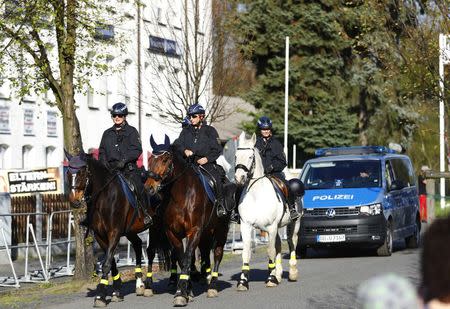 German police officers on horses patrol during the far-right rock music festival "Schwert und Schild" (Sword and Shield) in Ostritz, Germany April 20, 2018. REUTERS/Hannibal Hanschke