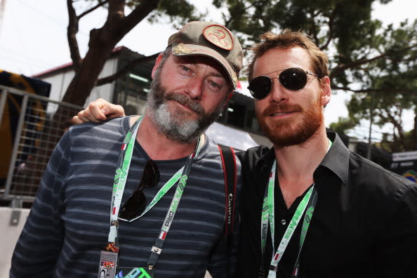 Actors Liam Cunningham and Michael Fassbender are seen on the grid before the Monaco Formula One Grand Prix at the Circuit de Monaco on May 27, 2012 in Monte Carlo, Monaco. (Photo by Mark Thompson/Getty Images)