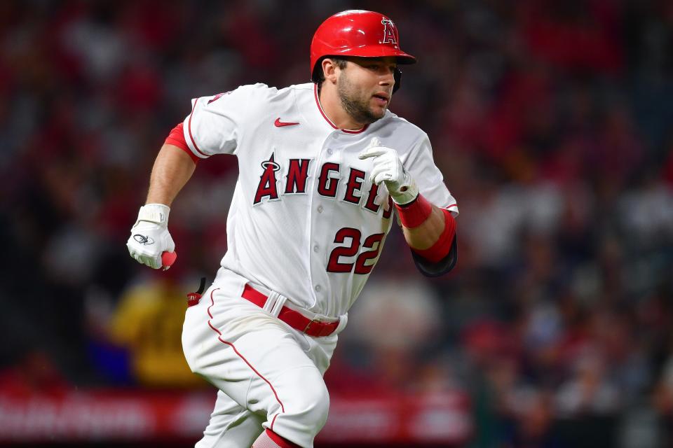 Then-Los Angeles Angels second baseman David Fletcher (22) runs after hitting a single against the Texas Rangers during game in 2023 at Angel Stadium.