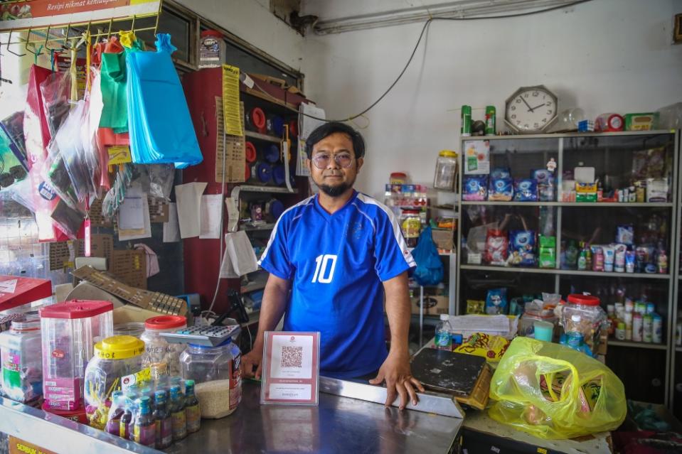 Business owner Yusof Yaab posing for a photograph at his shop in Jeniang, Kedah, August 8, 2023. — Picture by Yusof Mat Isa