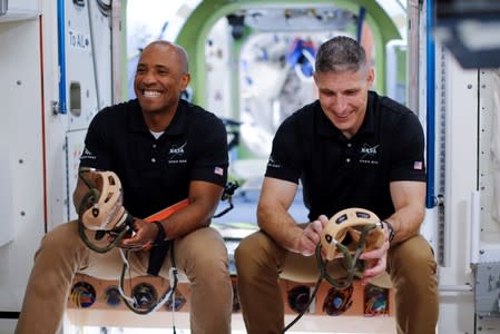 NASA commercial crew astronauts Michael Hopkins and Victor Glover run through a training session at a replica International Space Station (ISS) at the Johnson Space Center in Houston, Texas