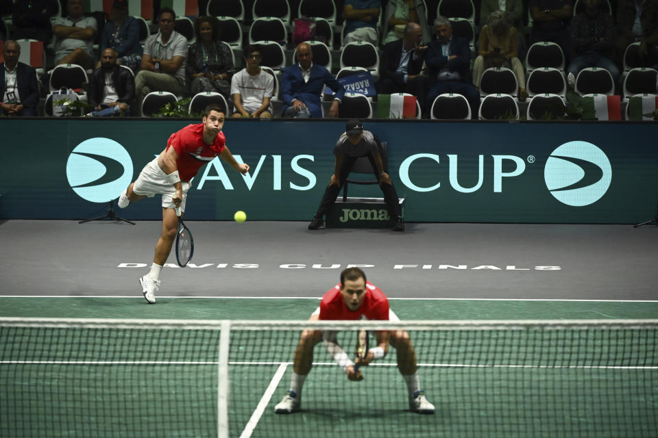 Canada's Alexis Galarneau and Vasek Pospisil in action against Italy's Simone Bolelli and Matteo Arnaldi during the Davis Cup group stage tennis match at the Unipol Arena, Bologna, Italy, Wednesday, Sept. 13. 2023. (Massimo Paolone/PA via AP)