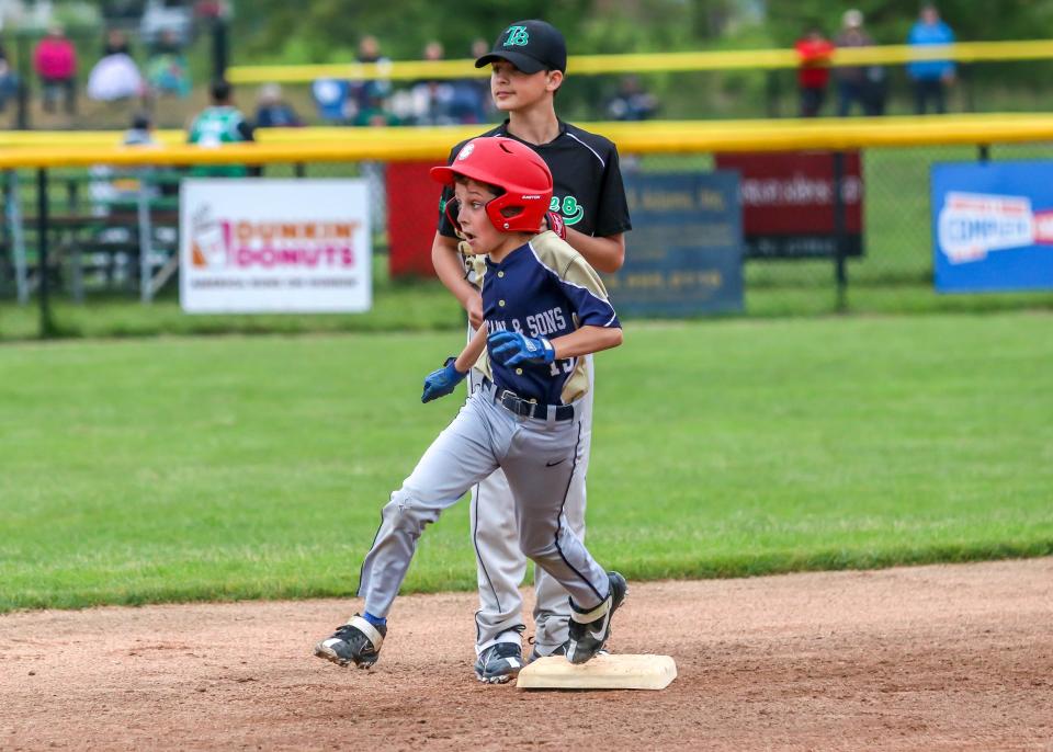 Nick Frias of McCann & Son's goes from first to third on a hit to left field. Frias had a great week to earn player of the week honors. He was 7 for 8 at the plate and knocked in five RBIs.