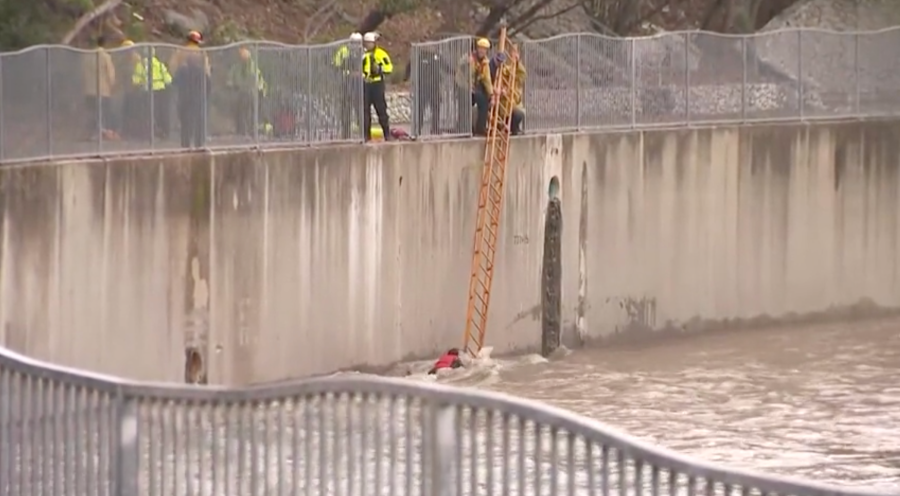 Firefighters rescue woman from storm-flooded L.A. River