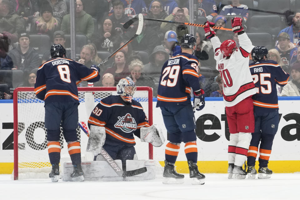 Carolina Hurricanes center Sebastian Aho (20) reacts after scoring a goal past New York Islanders goaltender Ilya Sorokin (30) during the second period of an NHL hockey game, Saturday, Jan. 21, 2023, in Elmont, N.Y. (AP Photo/Mary Altaffer)