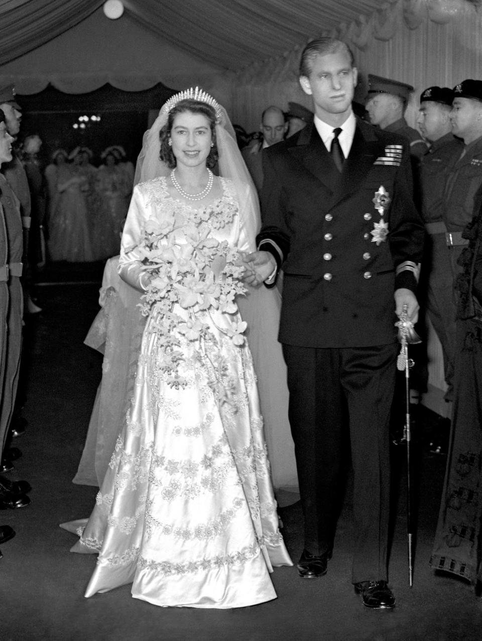 Princess Elizabeth and the Duke of Edinburgh (formerly Lt Philip Mountbatten, RN) as they leave Westminster Abbey after their marriage ceremony.   (Photo by PA Images via Getty Images)