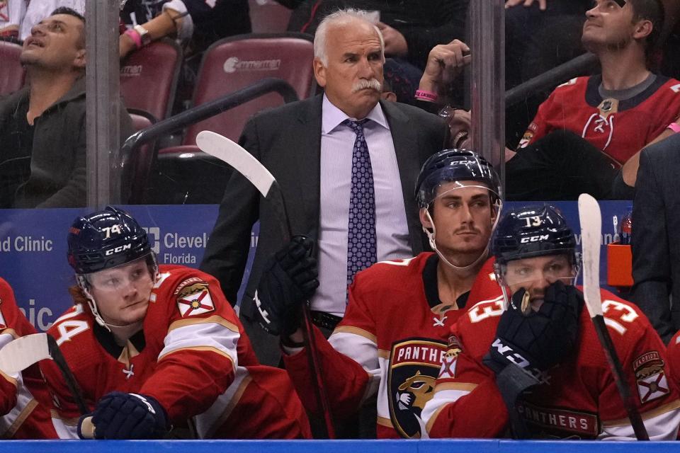 Florida Panthers head coach Joel Quenneville watches from the bench behind his players during the second period against the Boston Bruins at FLA Live Arena.