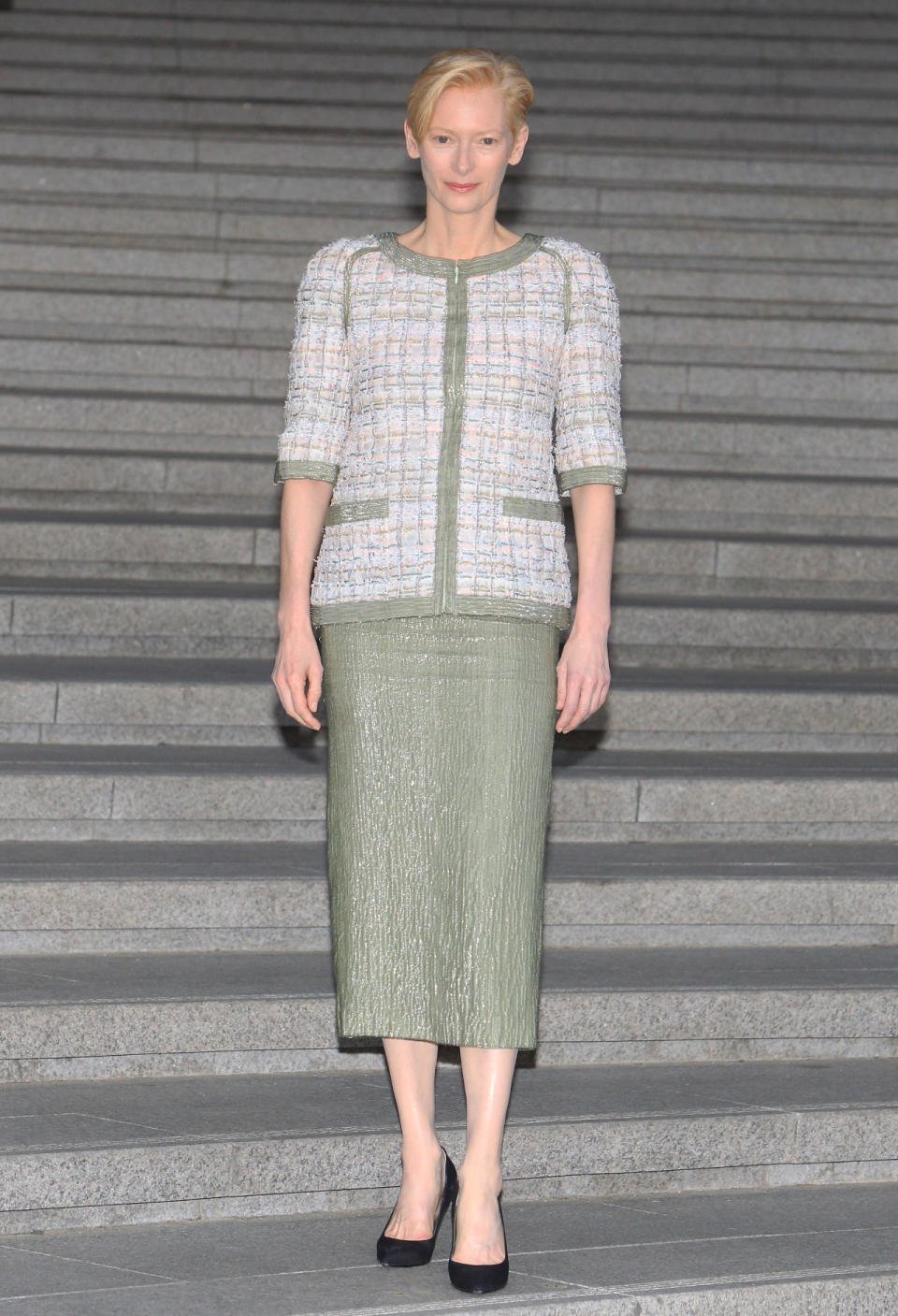 The artist/actress brought her always stylish self all the way to South Korea to support Chanel. For the occasion, she wore a seafoam green pencil skirt with a classic Chanel tweed coat.