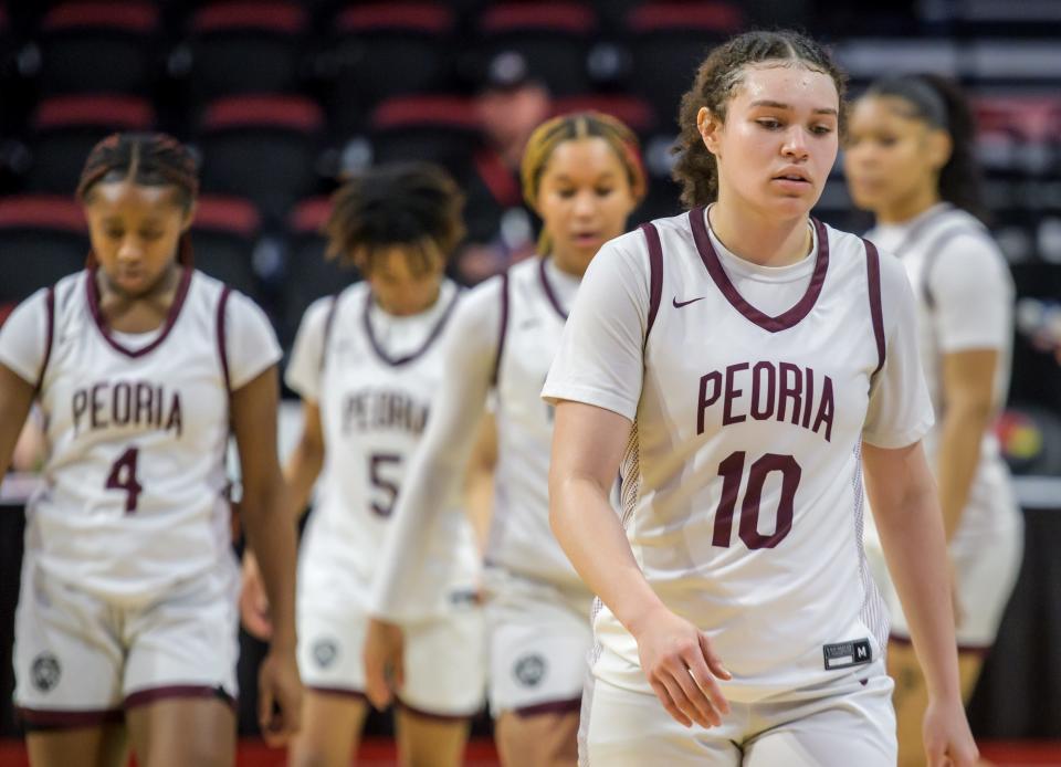 Denali Craig-Edwards (10) and the Peoria High Lions leave the court after their 48-35 loss to Nazareth Academy in the Class 3A state semifinals Friday, March 3, 2023 at CEFCU Arena in Normal.