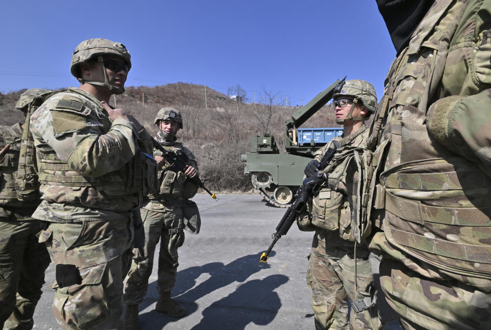 U.S. soldiers gather after a joint live fire exercise at a military training field in Pocheon, South Korea Thursday, March 14, 2024 as part of the annual Freedom Shield joint military exercise between South Korea and the United States. (Jung Yeon-je/Pool Photo via AP)