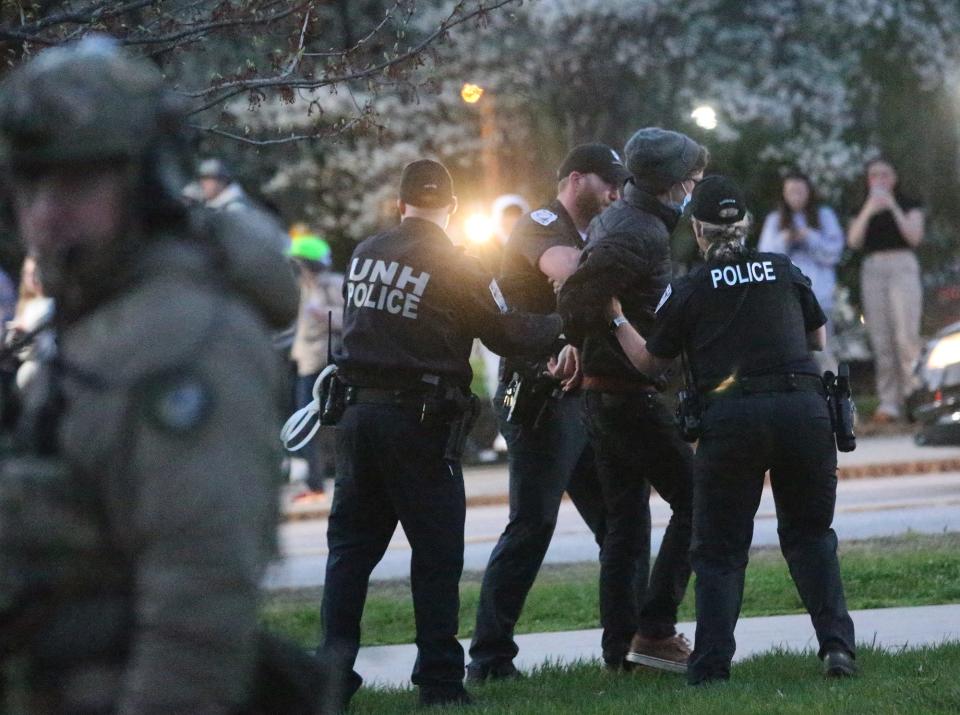 Police took action to remove and arrest pro-Palestinian protesters who started setting up an encampment in front of the University of New Hampshire's Thompson Hall Wednesday, May 1, 2024.