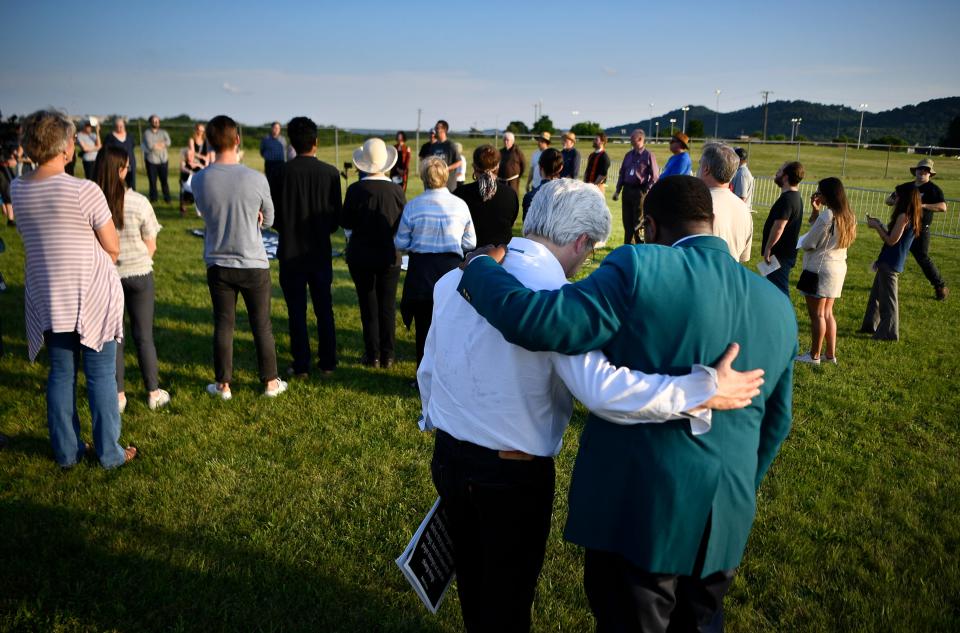 Protesters against the death penalty embrace as they wait for the execution of Donnie Johnson at Riverbend Maximum Security Institution Thursday, May 16, 2019 in Nashville, Tenn.