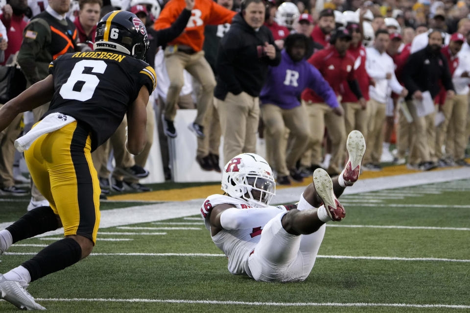 Rutgers cornerback Max Melton, right, intercepts an Iowa pass late in the first half of an NCAA college football game Saturday, Nov. 11, 2023, in Iowa City, Iowa. (AP Photo/Bryon Houlgrave)