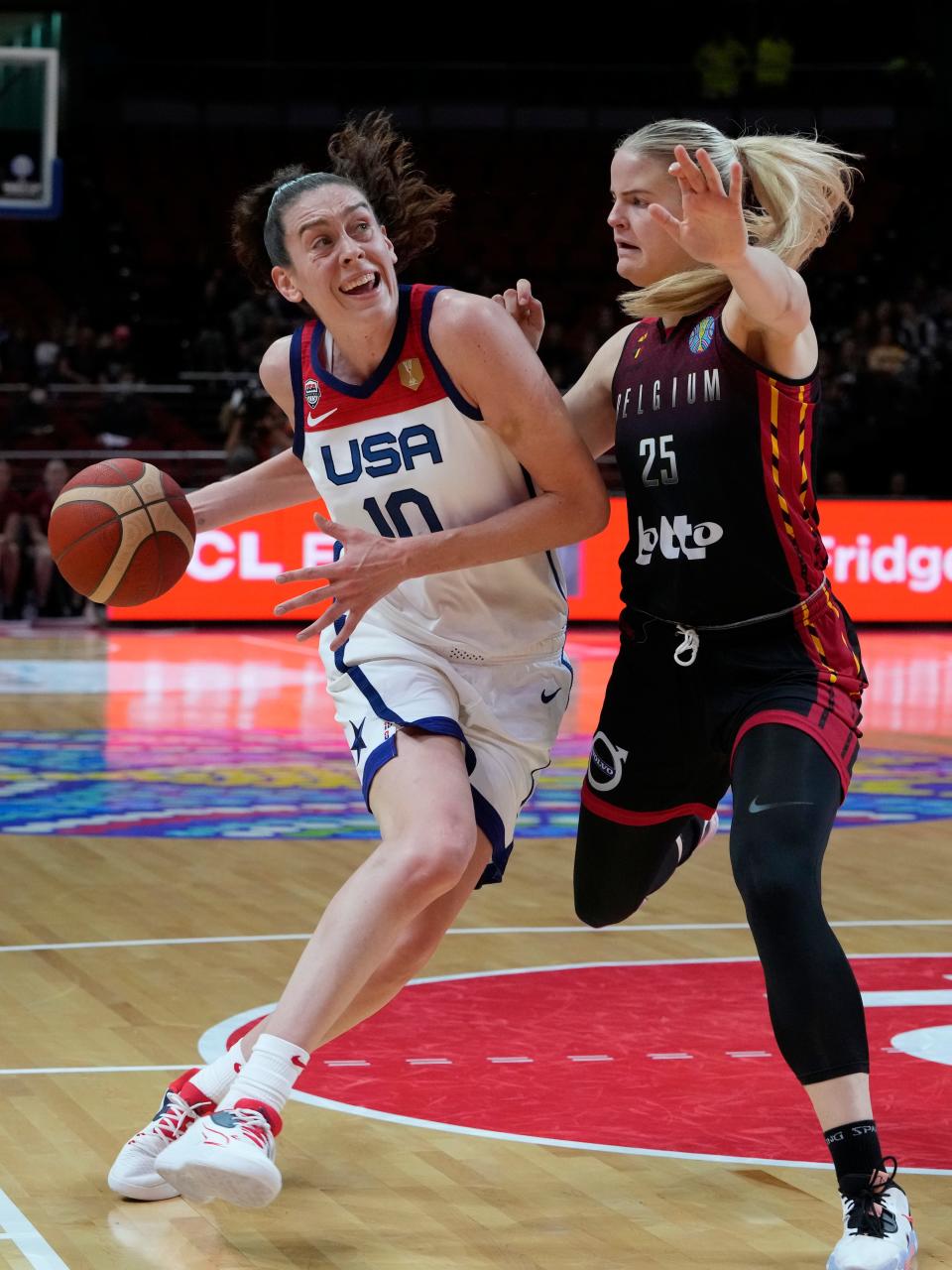 United States' Breanna Stewart, drives past Belgium's Becky Massey during their women's Basketball World Cup game in Sydney, Australia, Thursday, Sept. 22, 2022. (AP Photo/Mark Baker)