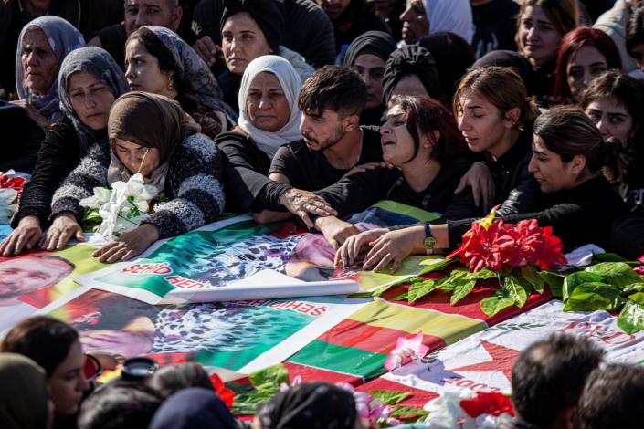 Syrian Kurds attend a funeral of people killed in Turkish airstrikes in the village of Al Malikiyah , northern Syria (AP)