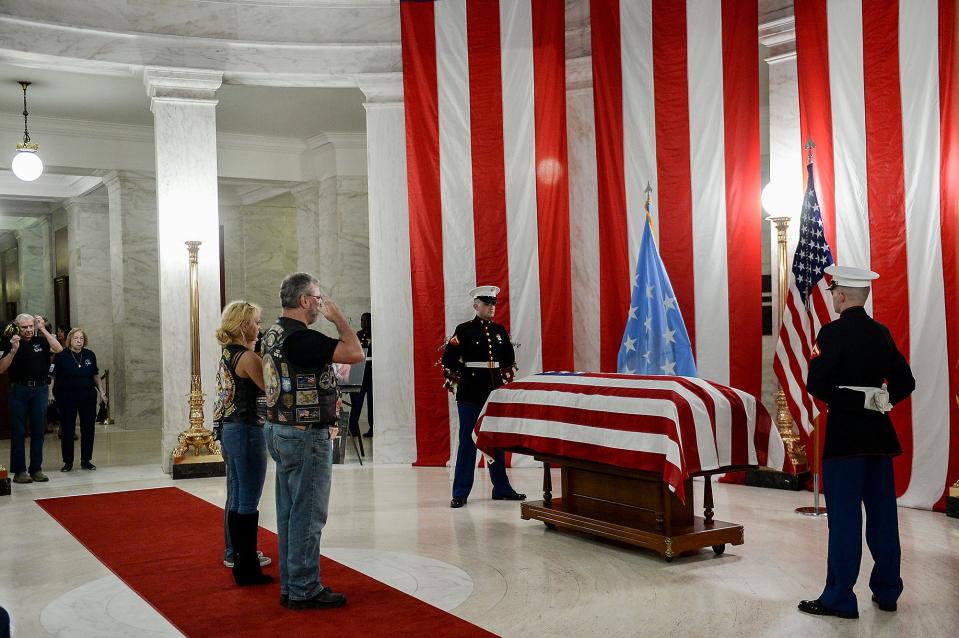 People salute the casket of Hershel "Woody" Williams set up in the first floor rotunda of the West Virginia State Capitol in Charleston, W.Va., for visitation on July 2, 2022. Williams, 98, a West Virginian who was the last living Medal of Honor recipient from World War II, died on Wednesday, June 29.