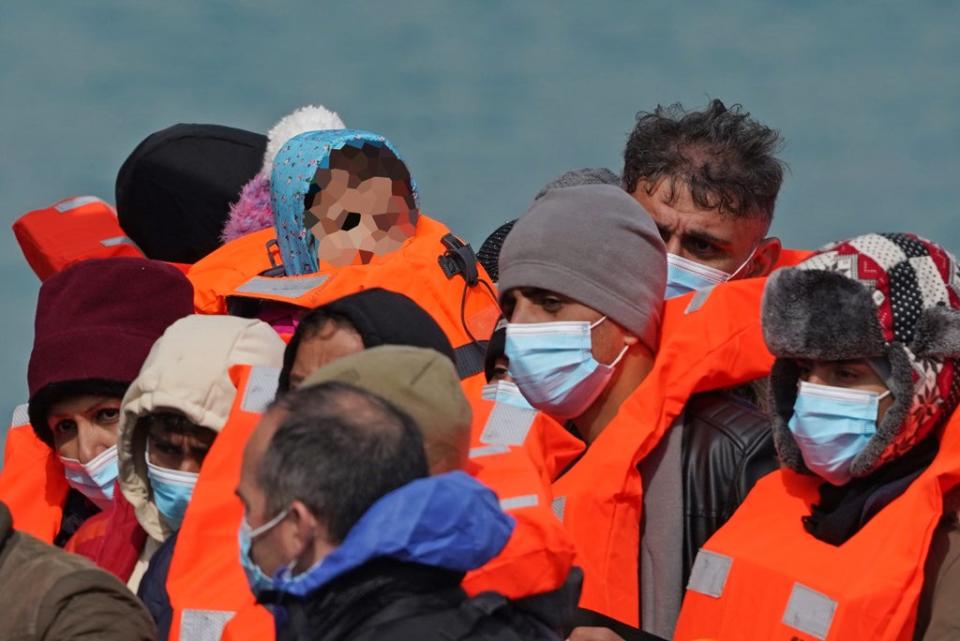 A young child (face pixelated) amongst a group of people thought to be migrants are brought in to Dover, Kent, following a small boat incident in the Channel (Gareth Fuller/PA) (PA Wire)