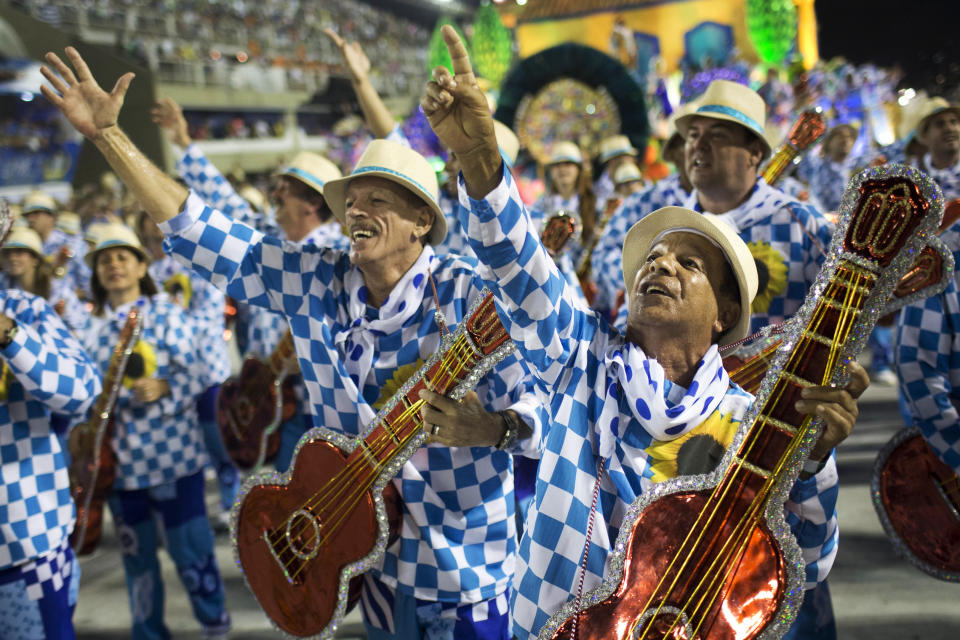 Performers from the Unidos de Vila Isabel samba school parade during Carnival celebrations at the Sambadrome in Rio de Janeiro, Tuesday, Feb. 12, 2013. Rio de Janeiro's samba schools vied for the title of the year's best in an over-the-top, all-night-long Carnival parade at the city's iconic Sambadrome. (AP Photo/Felipe Dana)