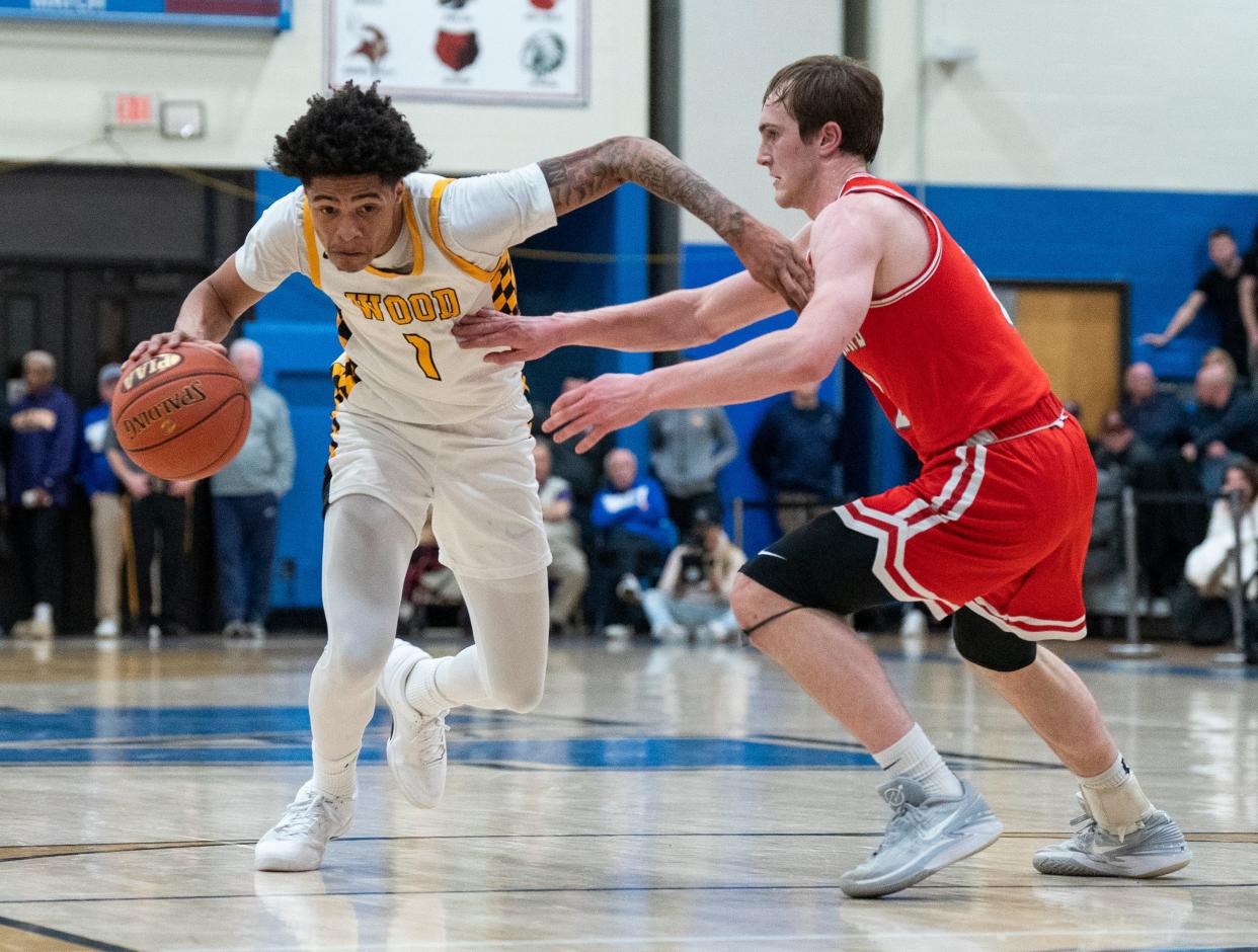 Archbishop Wood's Jalil Bethea (1) tries to get past Parkland's Nick Coval (2) during a state semifinal game.