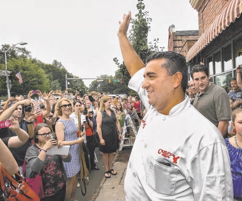 Carlo’s Bakery, of TLC’s “Cake Boss” fame, celebrated the grand opening of its new store in Westfield. The show’s star, Buddy Valastro Jr., waved to the crowd on Sunday, Sept. 1, 2013.