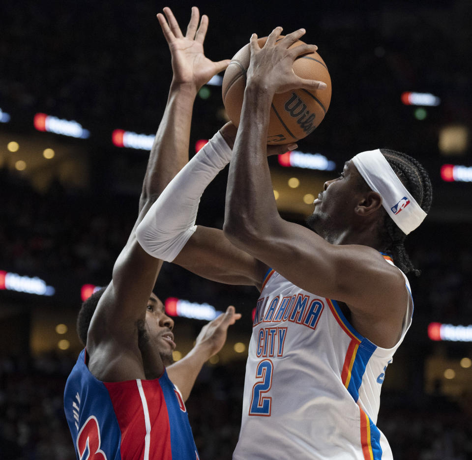 Oklahoma City Thunder's Shai Gilgeous-Alexander (2) shoots over Detroit Pistons' James Wiseman (13) during the first half of an NBA preseason basketball game Thursday, Oct. 12, 2023, in Montreal. (Christinne Muschi/The Canadian Press via AP)