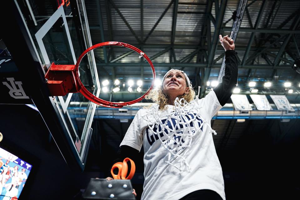 URI women's basketball head coach Tammi Reiss celebrates the Rams' victory over Dayton on Saturday at the Ryan Center. The win clinched at least a share of the regular-season championship.