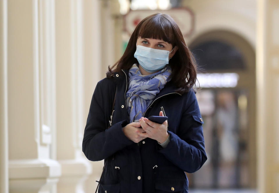 MOSCOW, RUSSIA - MARCH 25, 2020: A woman wears a face mask at the GUM department store amid the ongoing COVID-19 pandemic. Vyacheslav Prokofyev/TASS (Photo by Vyacheslav Prokofyev\TASS via Getty Images)