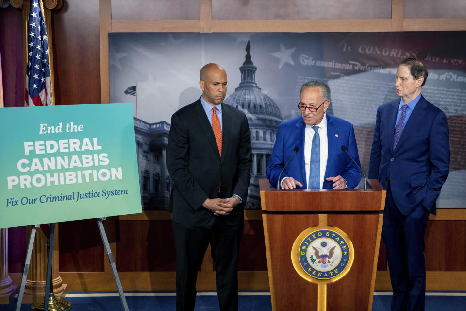 From left, Sen. Cory Booker, D-N.J.,Senate Majority Leader Chuck Schumer, D-N.Y., and Sen. Ron Wyden, D-Ore., announce a draft bill that would decriminalize marijuana on a federal level Capitol Hill in Washington, on Wednesday, July 14, 2021. The bill, called the Cannabis Administration and Opportunity Act, would not only decriminalize marijuana, but also expunge the records of those with non-violent convictions related to cannabis and invest money into restorative justice programs. (AP Photo/Amanda Andrade-Rhoades)