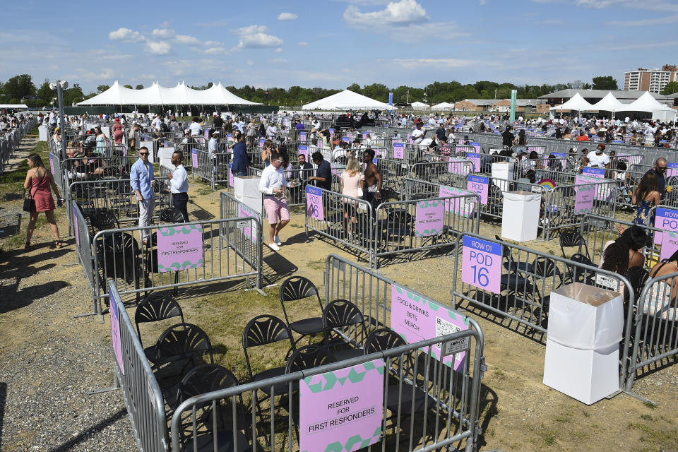 Socially distanced areas are seen near a stage during a concert in the infield during the 146th Preakness Stakes horse race at Pimlico Race Course, Saturday, May 15, 2021, in Baltimore. (AP Photo/Will Newton)