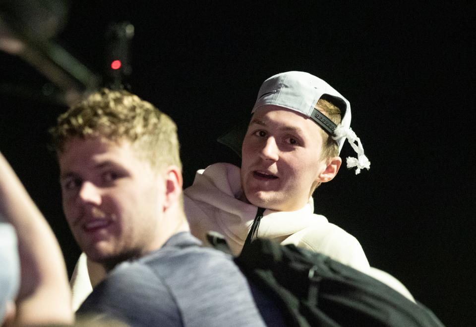 Purdue Boilermakers forward Caleb Furst (1) and Purdue Boilermakers guard Fletcher Loyer (2) ride on the Boilermaker Special after defeating Tennessee in the NCAA Tournament Elite Eight game, Sunday, March 31, 2024, at Purdue University Airport in West Lafayette, Ind.