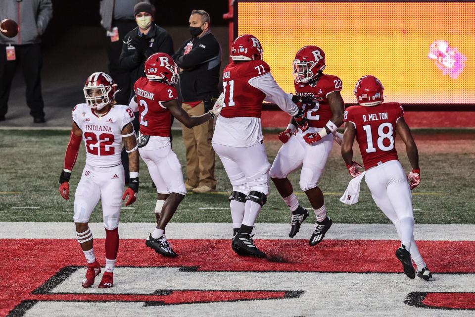 Rutgers running back Kay'Ron Adams celebrates a touchdown against Indiana with teammates.