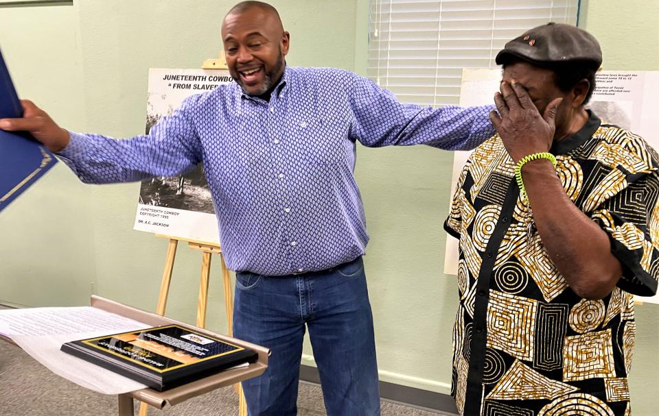 Tuesday's celebration of the "Juneteenth Cowboys" exhibit opening did not come without some kidding. Mayor Anthony Williams, left, ribbed honoree A.C. Jackson before presenting him with a certificate of appreciation from the city for his efforts to promote Black history.