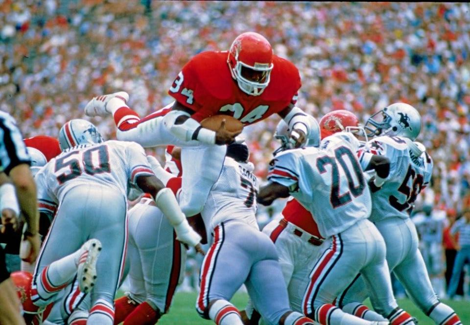 May 26, 1985; Tampa, FL, USA; FILE PHOTO;  New Jersey Generals running back Herschel Walker (34) in action against the Tampa Bay Bandits of the USFL during the 1985 season at Tampa Stadium. NJ defeated TB 30-24. Mandatory Credit: USA TODAY Sports
