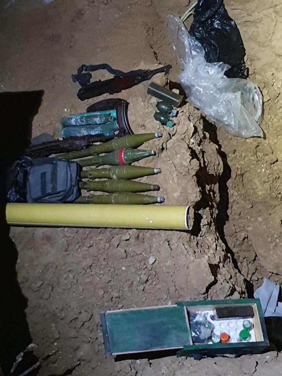 Israeli forces uncovered a Hamas tunnel underneath a building they raided. Inside, they found explosives and other weapons.