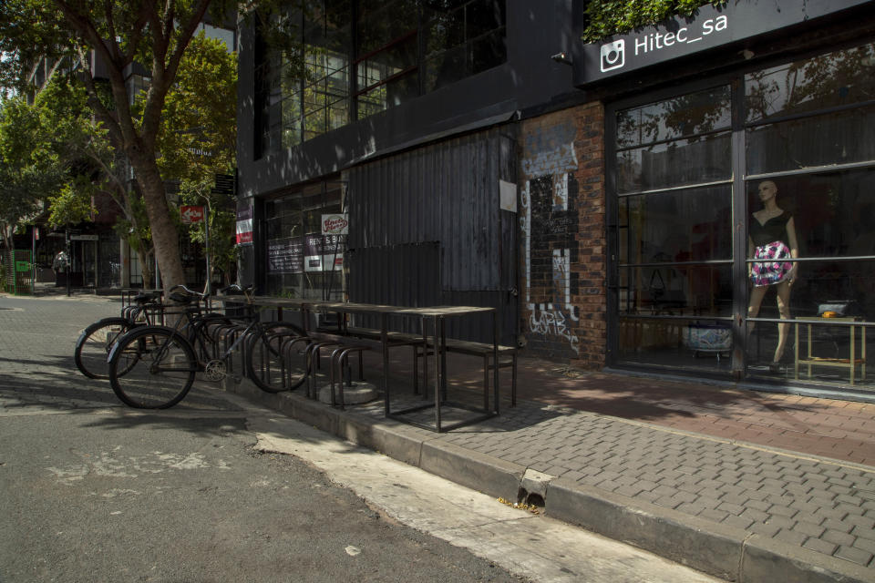 An empty street at Maboneng precinct in Johannesburg, South Africa, Saturday, March 28, 2020. South Africa went into a nationwide lockdown for 21 days in an effort to control the spread of the coronavirus. The new coronavirus causes mild or moderate symptoms for most people, but for some, especially older adults and people with existing health problems, it can cause more severe illness or death. (AP Photo/Themba Hadebe)