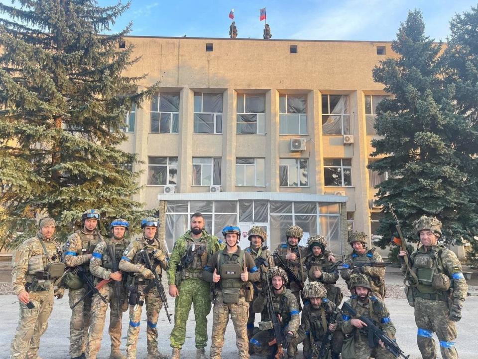 Ukrainian troops pose for a photo in Lyman - Oleksiy Biloshytskyi via REUTERS