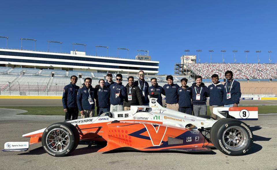 The Cavalier Autonomous Racing team stands behind their driverless race car. Cavalier Autonomous Racing, University of Virginia, <a href="http://creativecommons.org/licenses/by-nd/4.0/" rel="nofollow noopener" target="_blank" data-ylk="slk:CC BY-ND;elm:context_link;itc:0;sec:content-canvas" class="link ">CC BY-ND</a>