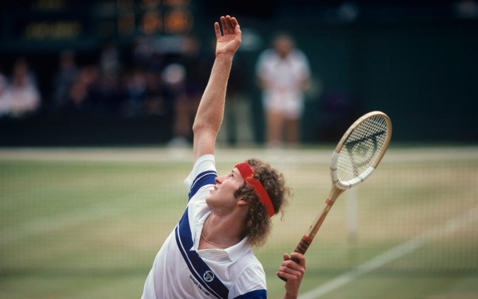 WIMBLEDON, UNITED KINGDOM - JULY: John McEnroe serving to Bjorn Borg in the men's final in 1981. - John Kelly/Getty Images